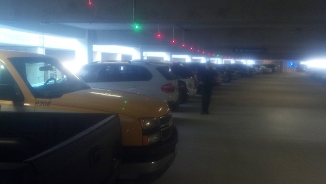 Parking garages with lights showing open spaces