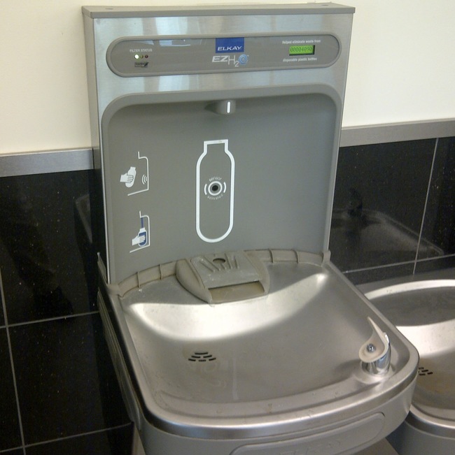 Water fountains with built-in water bottle filling station
