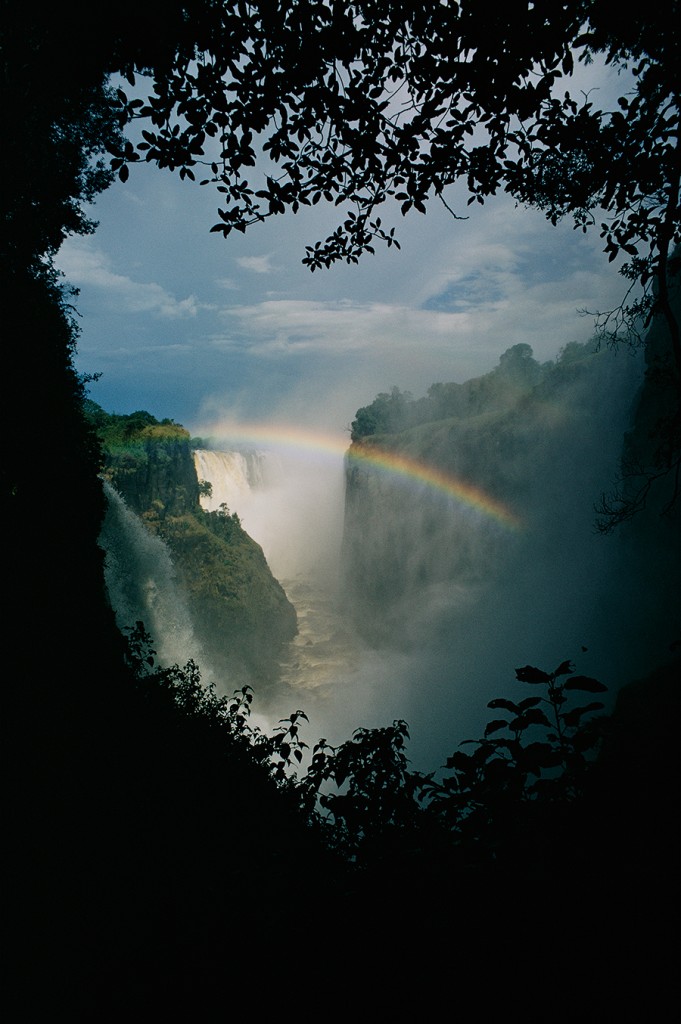 A rainbow arches over Victoria Falls in Zimbabwe in 1196