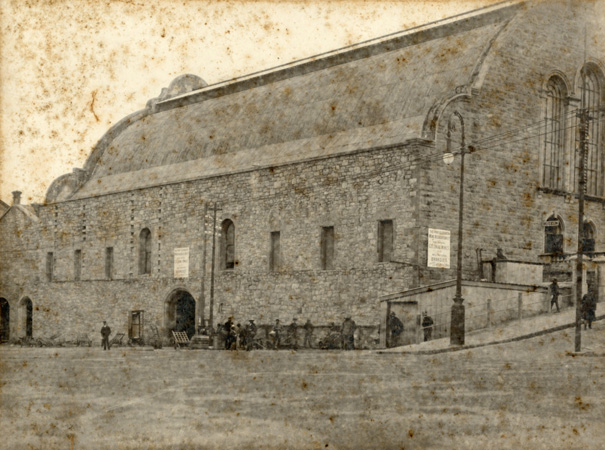 The Feathermarket Hall c. 1906. The museum lower rooms being used as bond store for P.E. Wine Association. Early electric arc-light standard